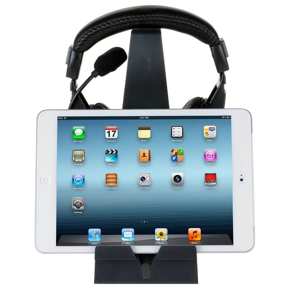 Isolated studio front photo of the Headset Hangout holding a white iPad and a pair of padded studio headphones with a boom microphone.