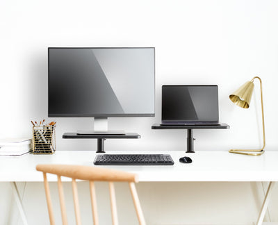 Lifestyle photo Ascend Monitor Stands on white desk with monitors and desk accessories 