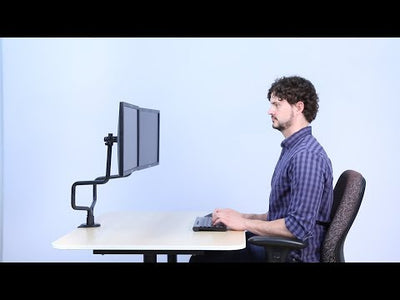 Video Studio image Metal Art Dual Monitor Arms - preview shows man at desk looking at monitors